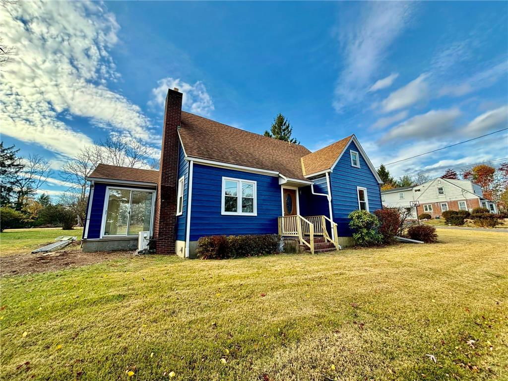 a front view of a house with yard and garage