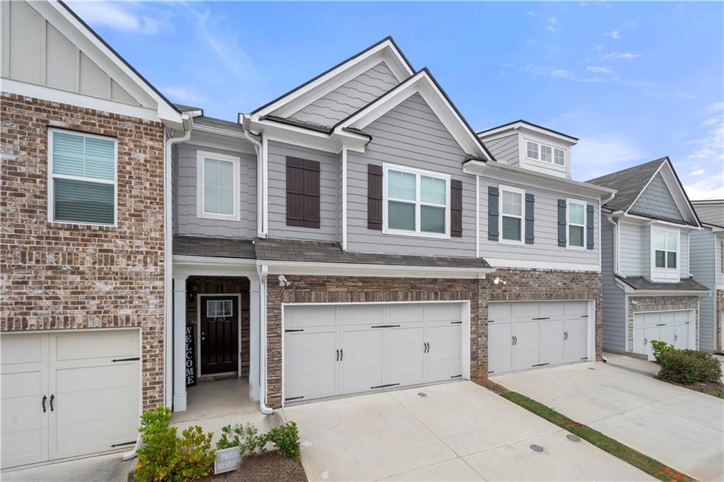 a front view of a house with a garage