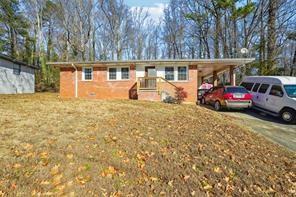 front view of a house with a big yard