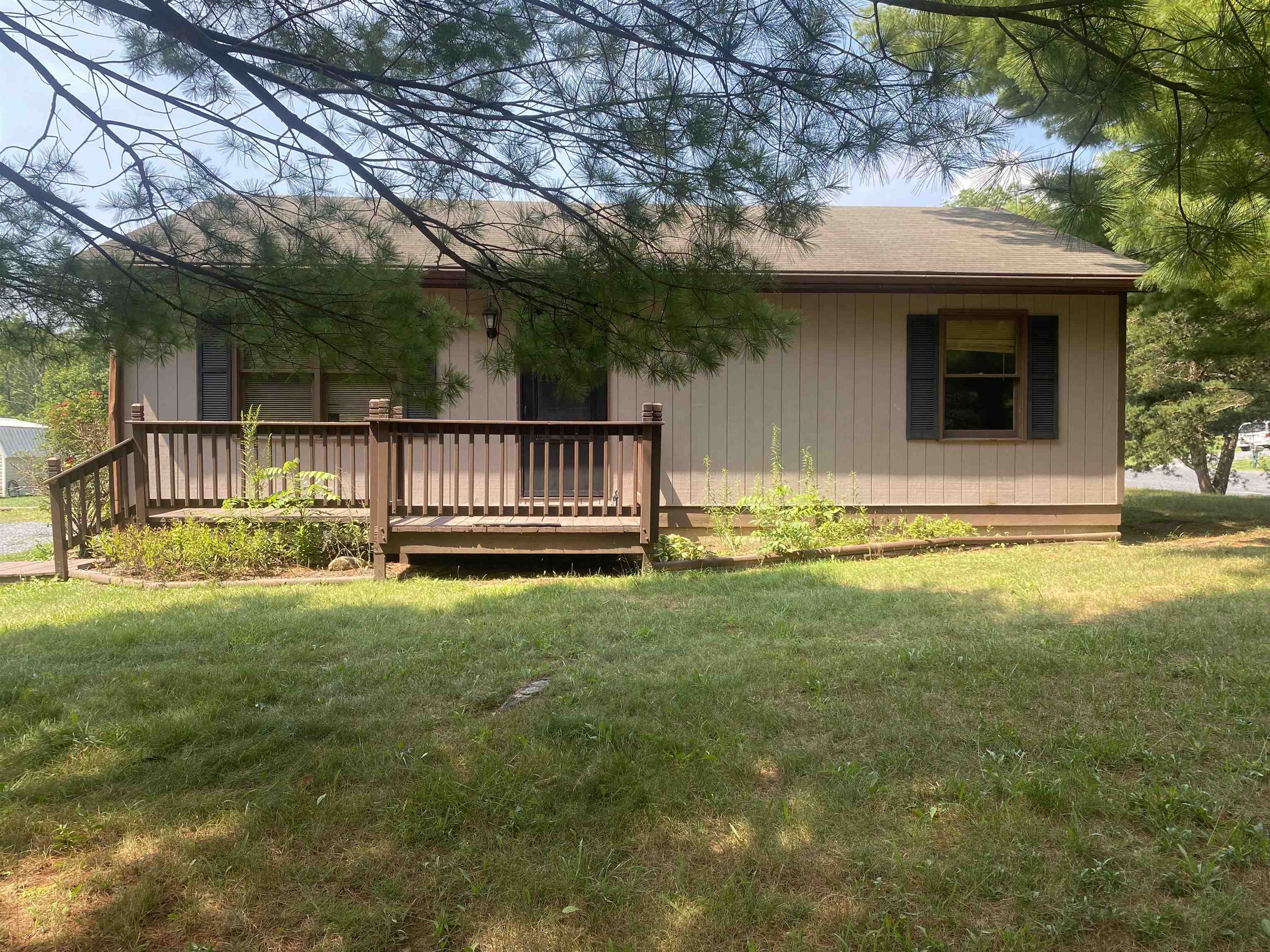 a view of backyard with deck