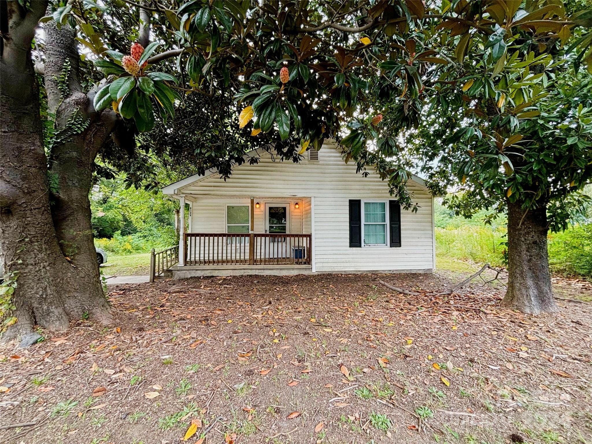 a house with trees in front of it