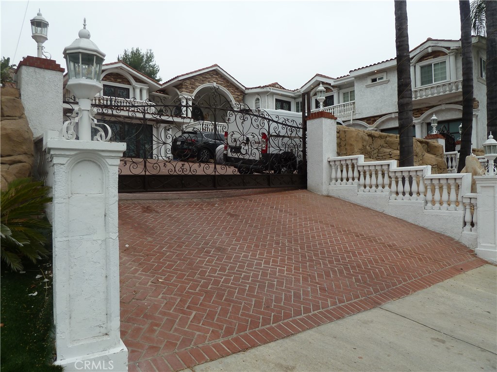 a view of a brick house with many windows