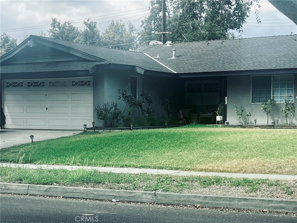 a view of a house with a garden