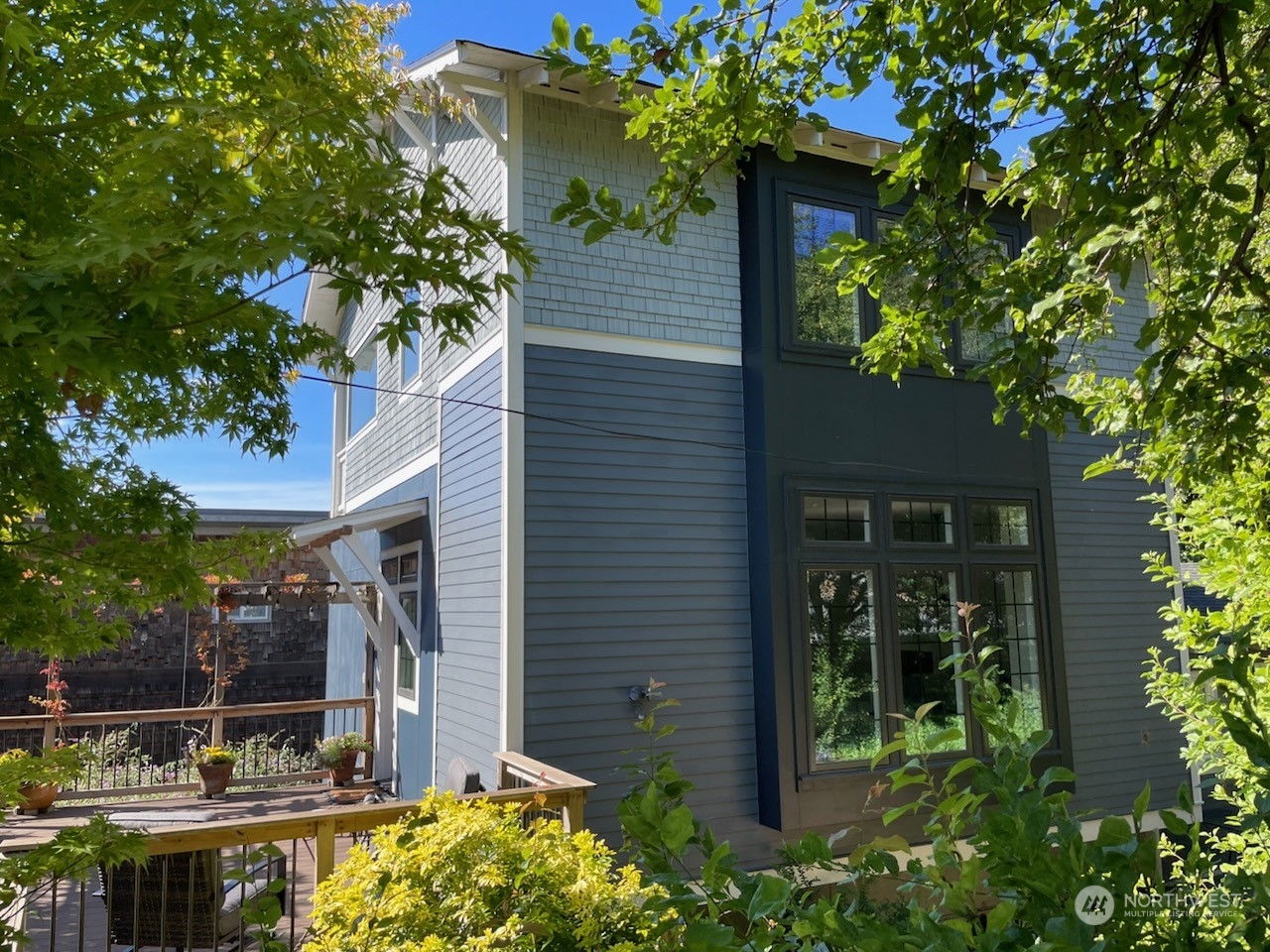 a view of house with tree in front of it