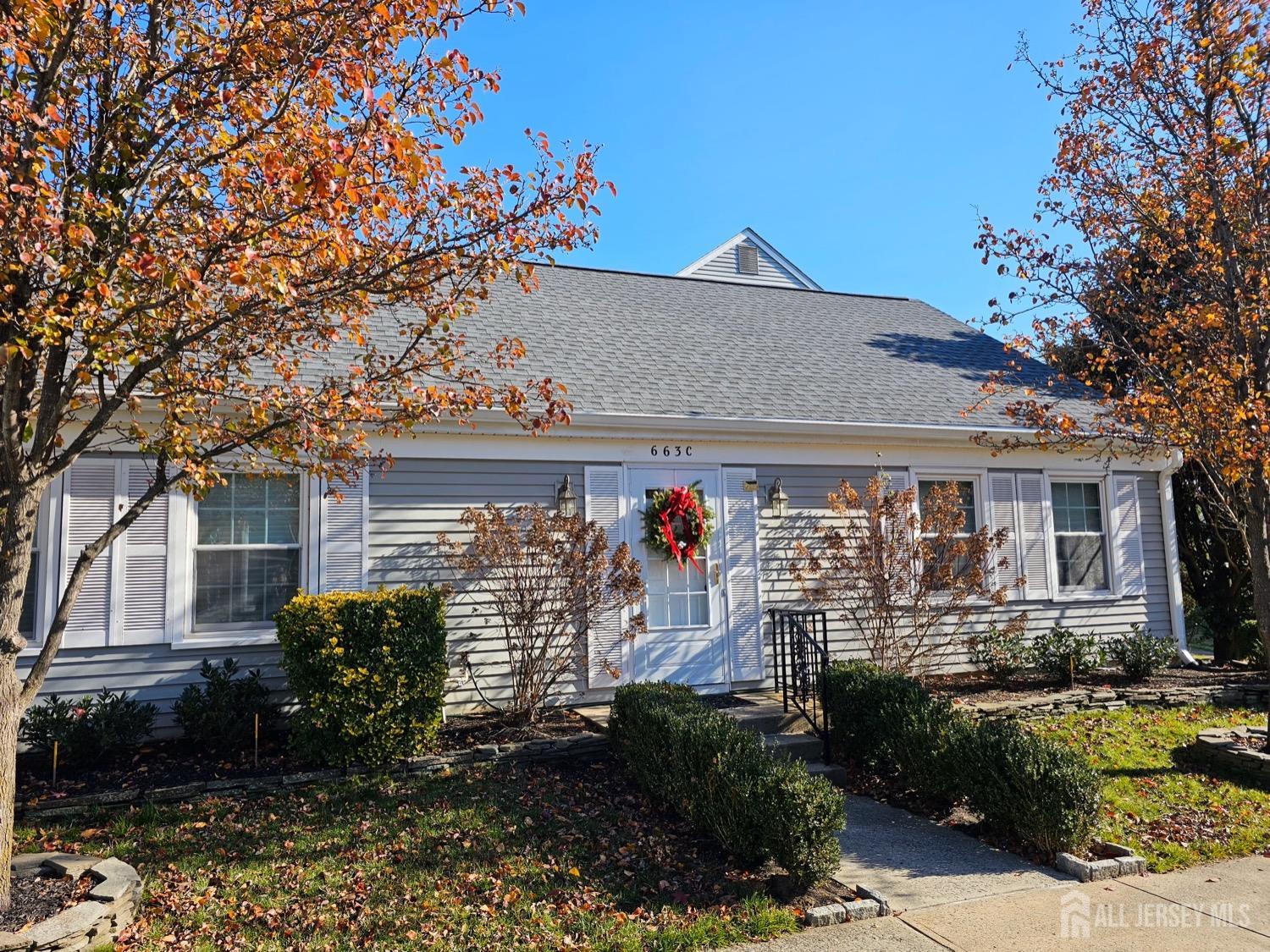 a front view of a house with yard