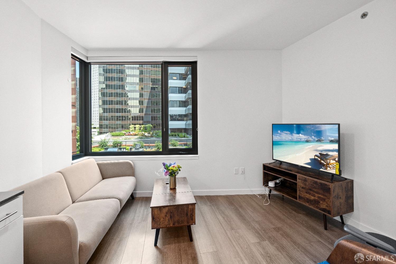 a living room with furniture and a window