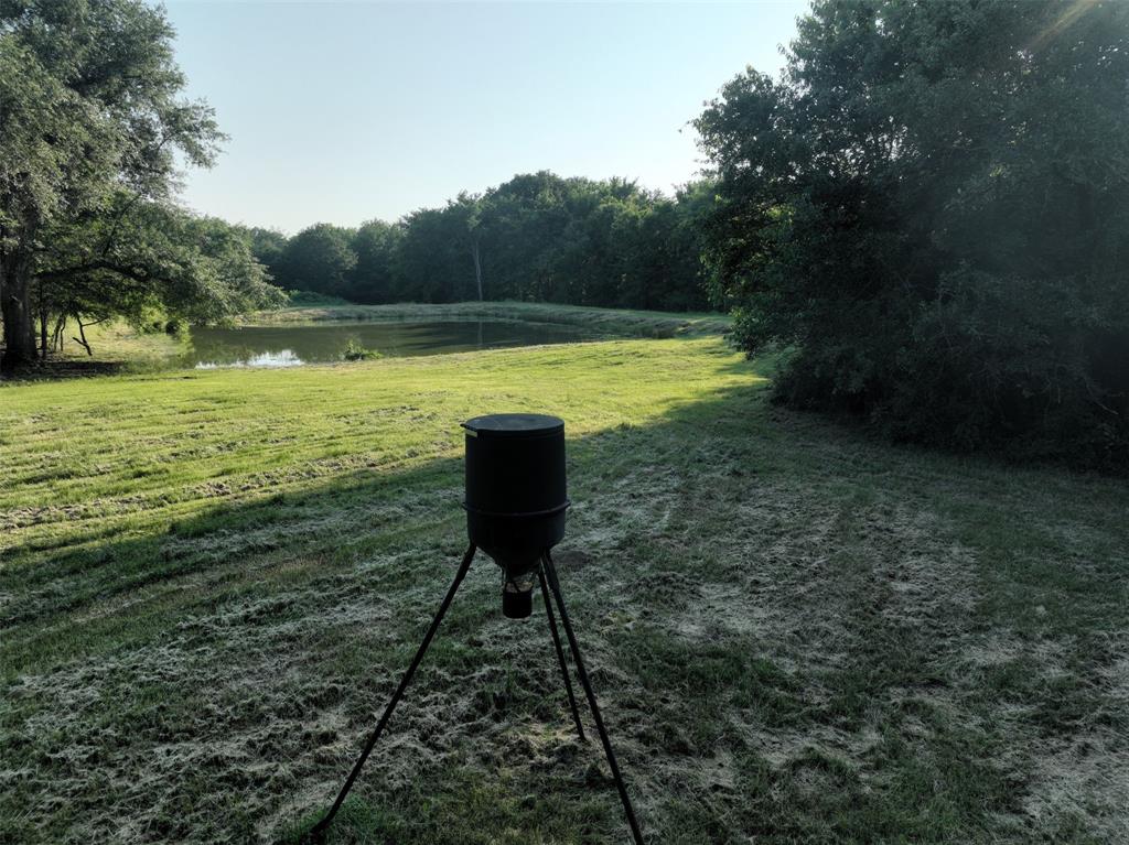 a view of a lake with a yard