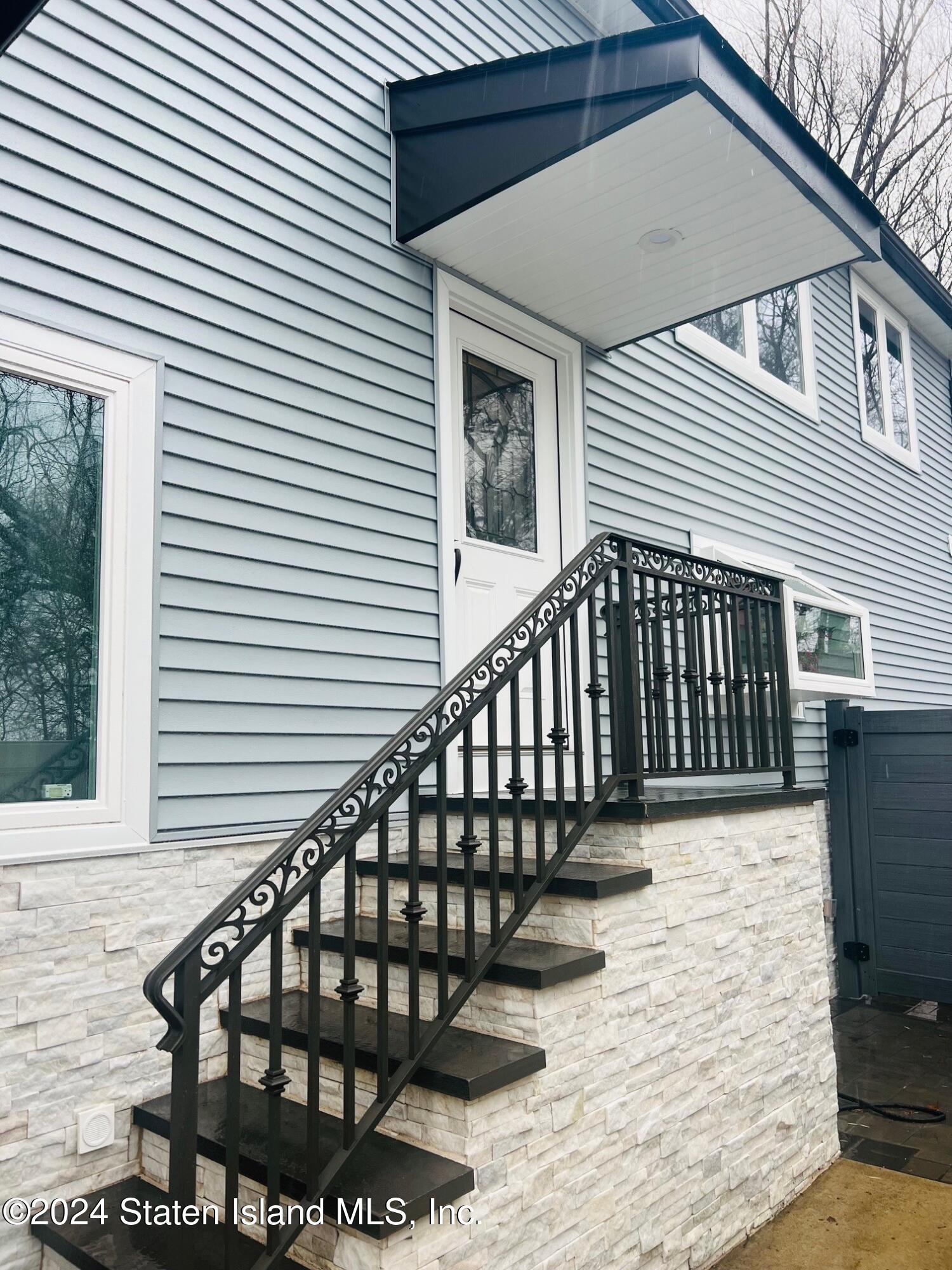 a view of entryway with wooden floor