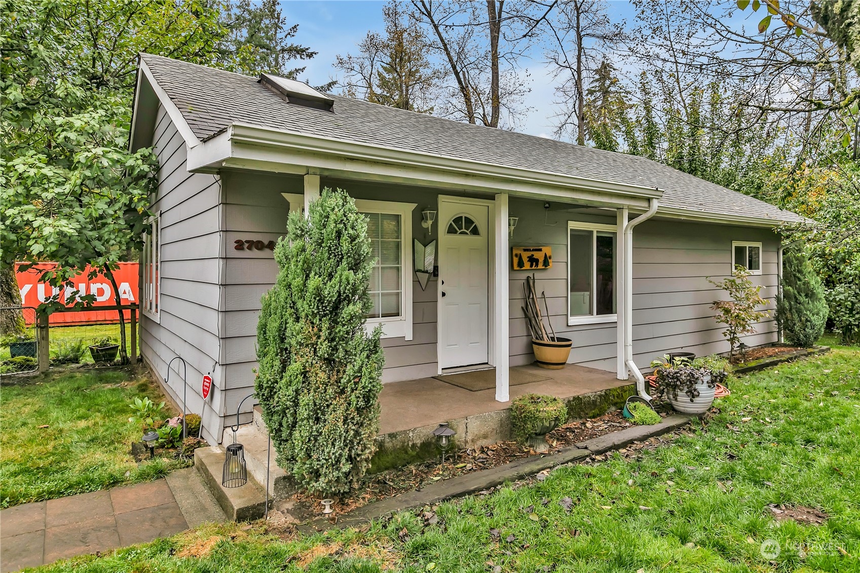 a front view of a house with garden