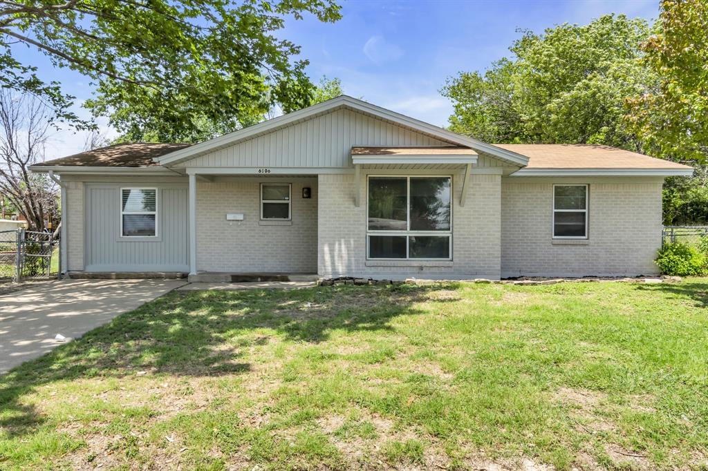 a house with yard in front of it