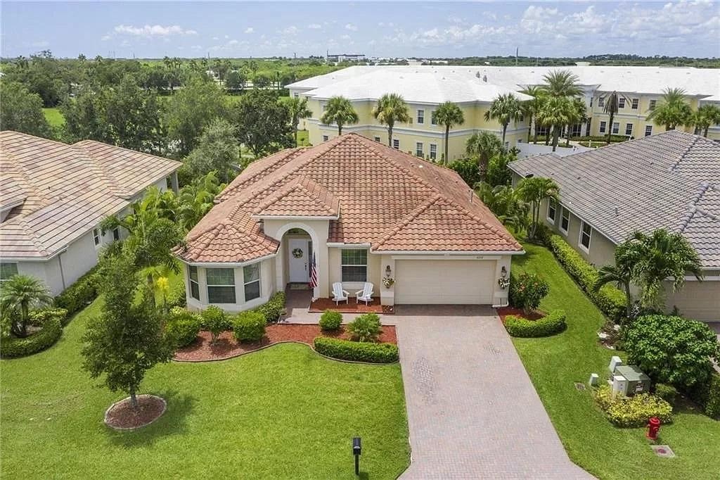 a aerial view of a house with table and chairs in patio