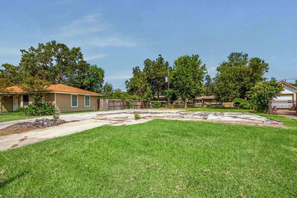 a swimming pool with outdoor seating and yard