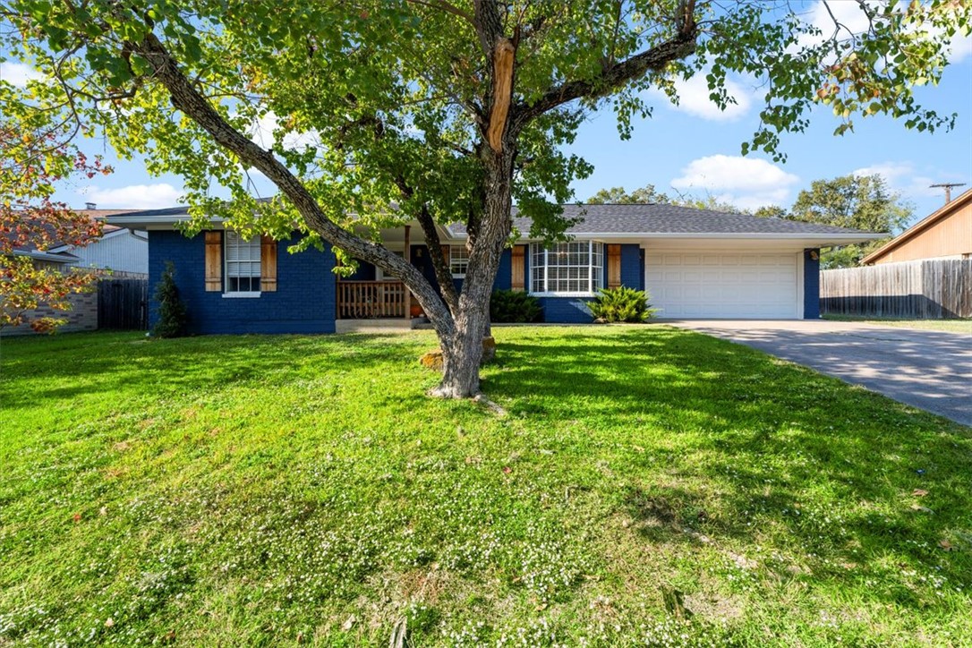 front view of a house with a yard