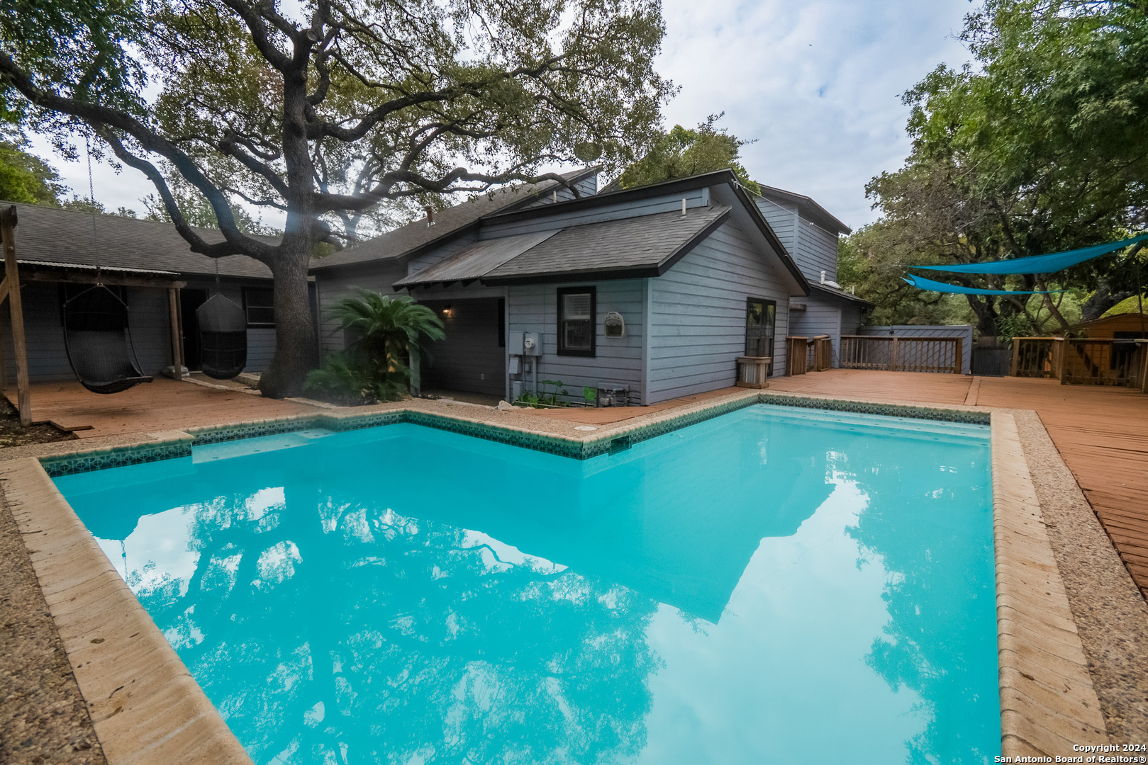 a front view of house with yard and outdoor seating