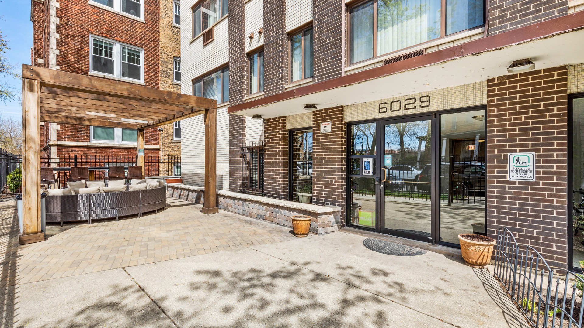 a view of a building with sitting area