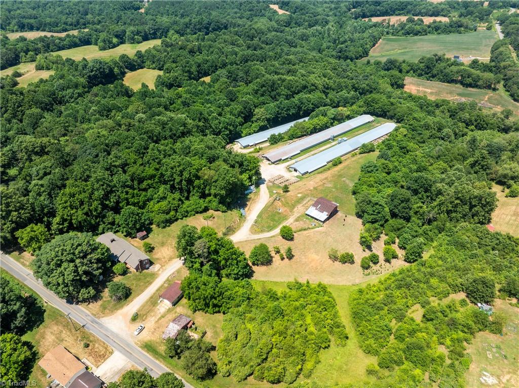 Aerial view of the poultry houses. House is shown on the left side above the farm road.