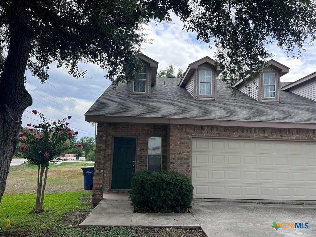 a front view of house with yard