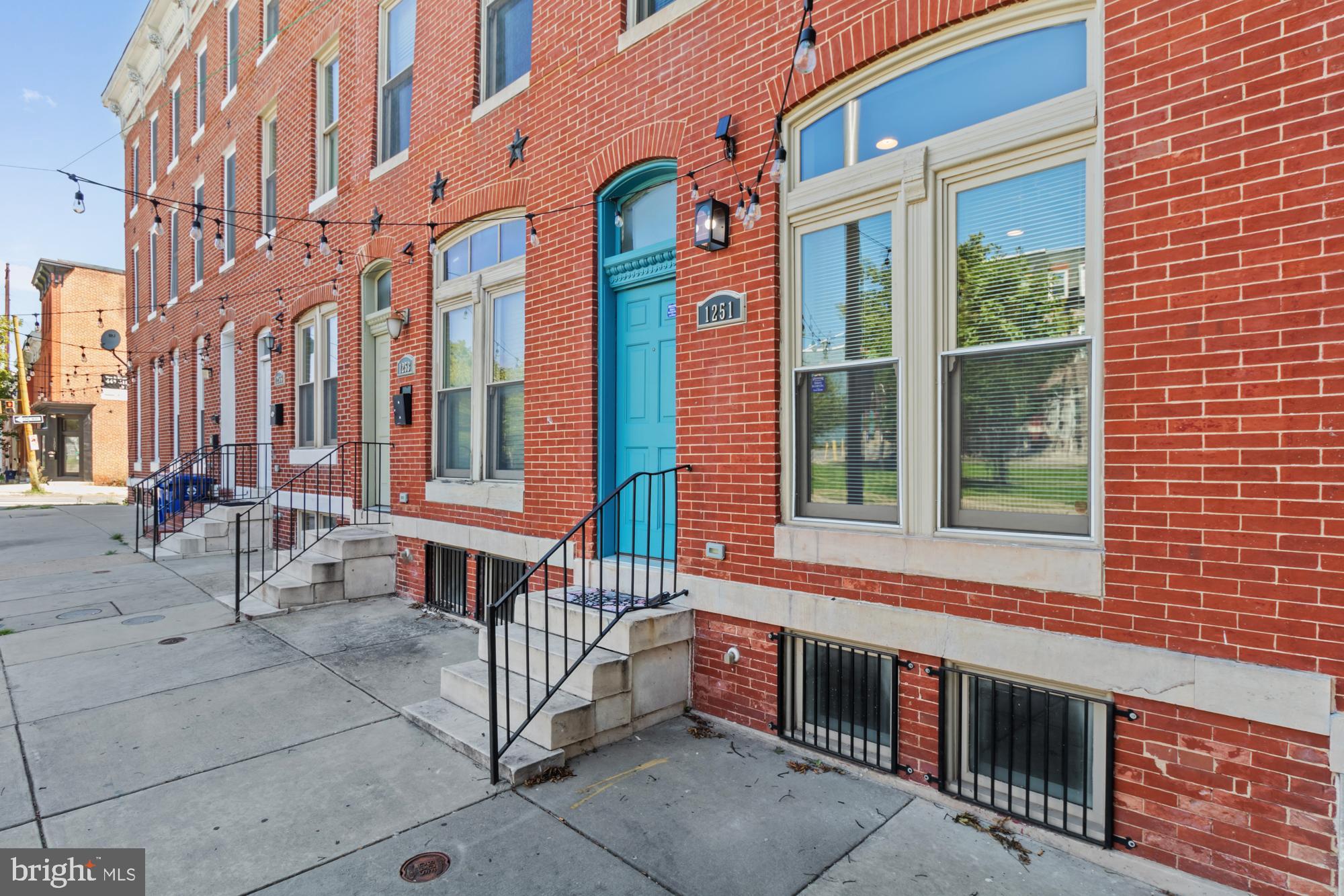 a front view of a building with a porch