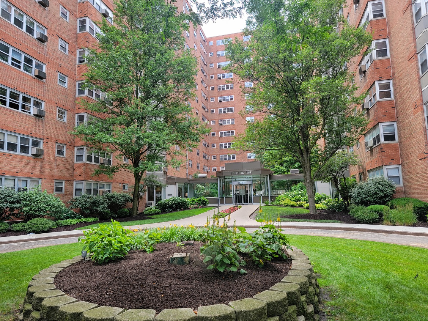 a view of a building with a yard