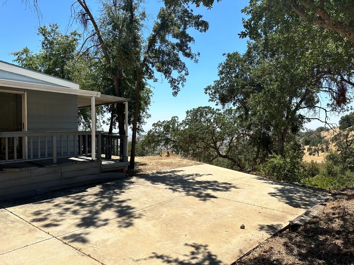 a view of a backyard of the house