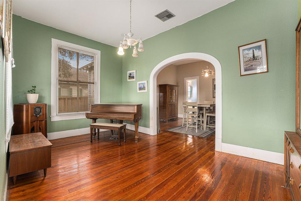 Welcome to the 1912 Craftsman Bungalow!  This is one of two living areas in this family friendly floor plan!  Original arch and moldings throughout.