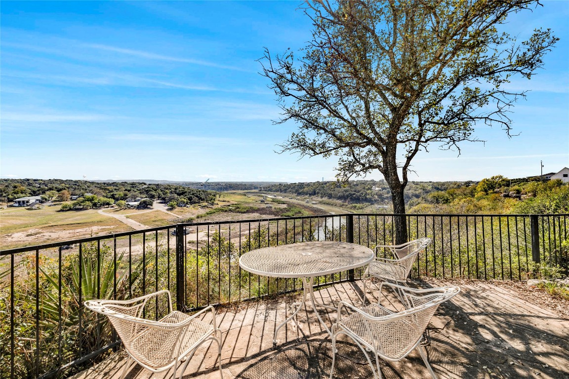 a view of a balcony with lake view and mountain view