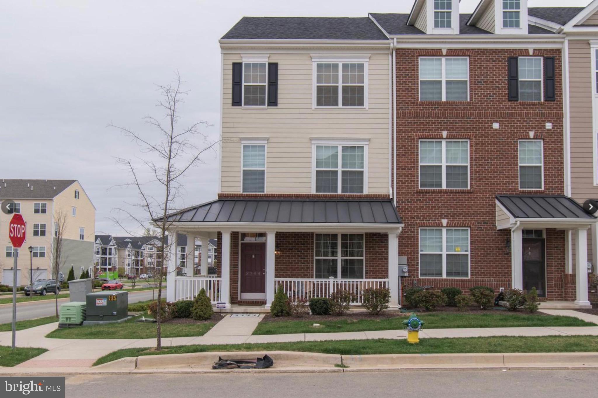 a front view of a building and that has a yard