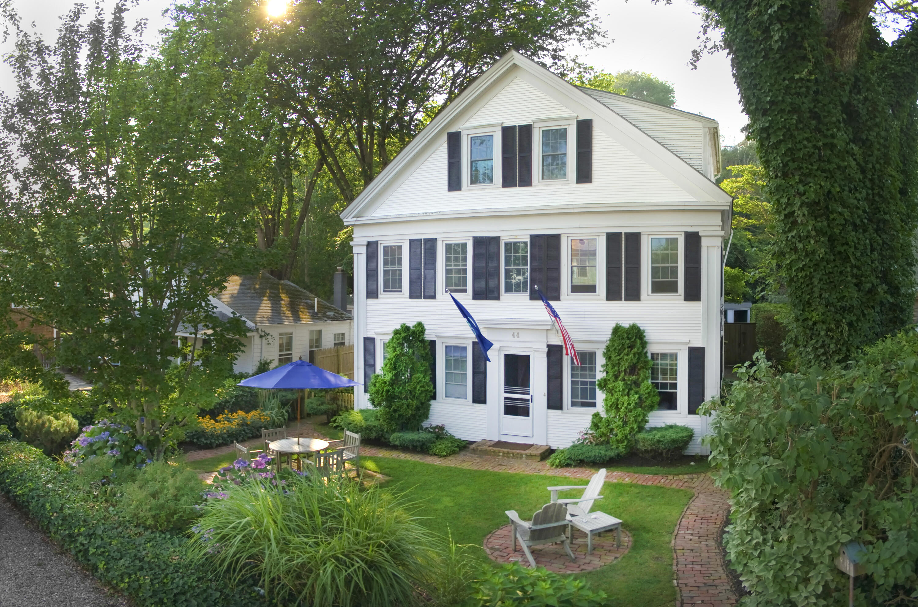 a front view of house with yard and green space