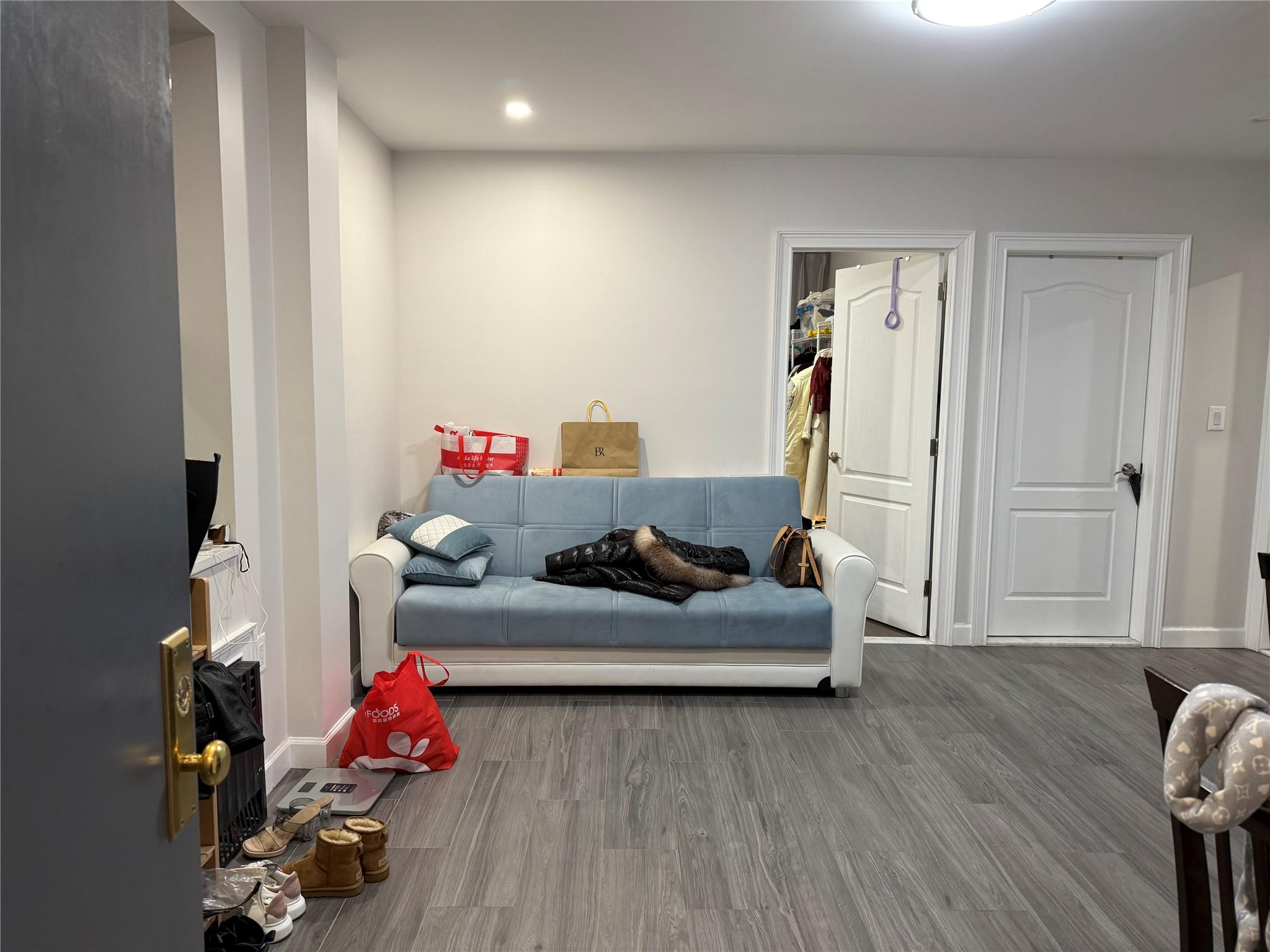 Sitting room with hardwood / wood-style floors