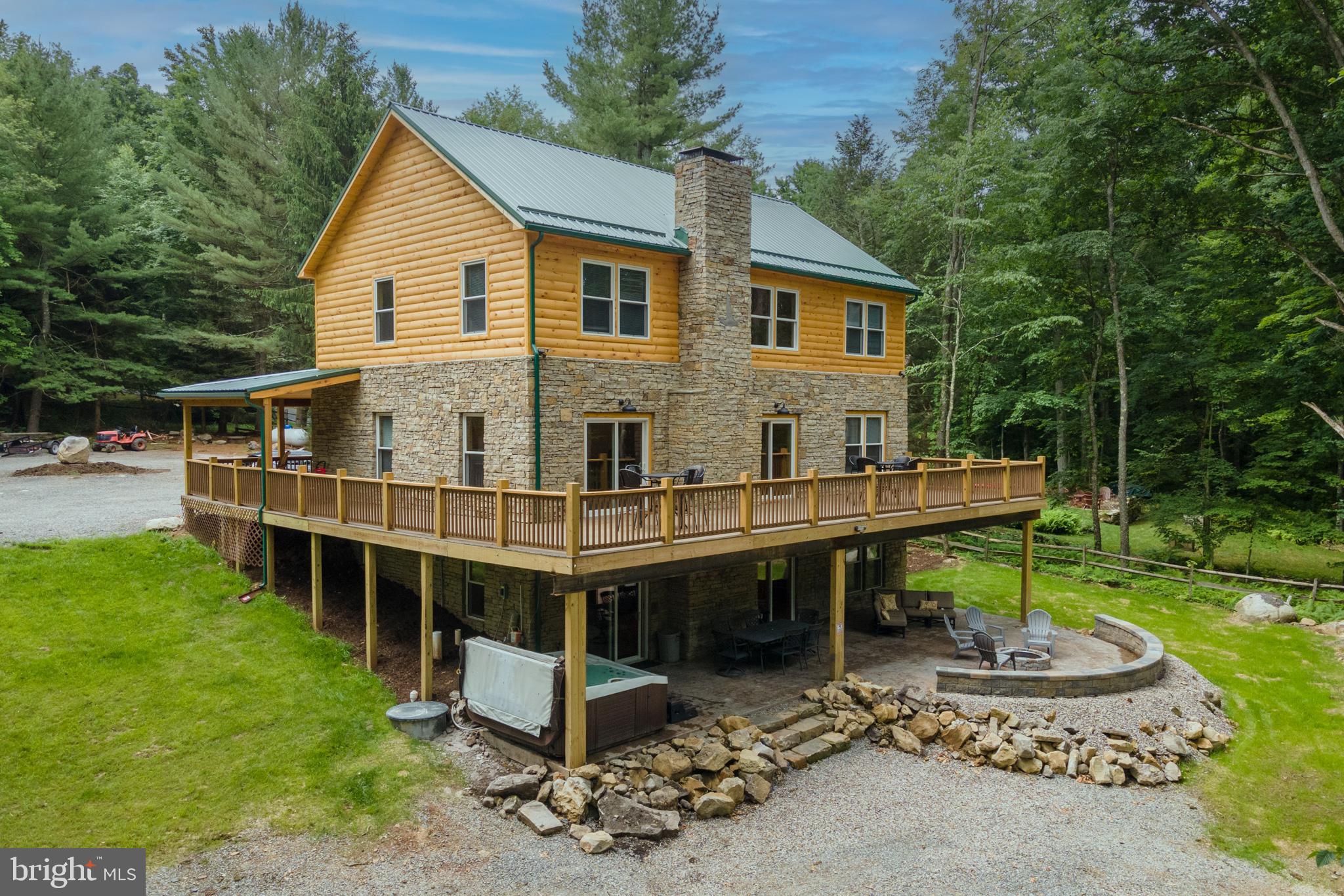 a view of a house with backyard porch and sitting area