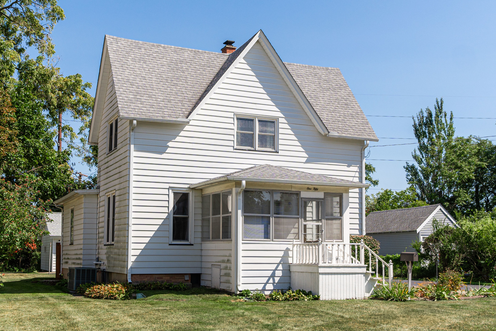 a view of house with yard