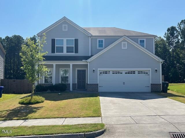 a front view of a house with garage