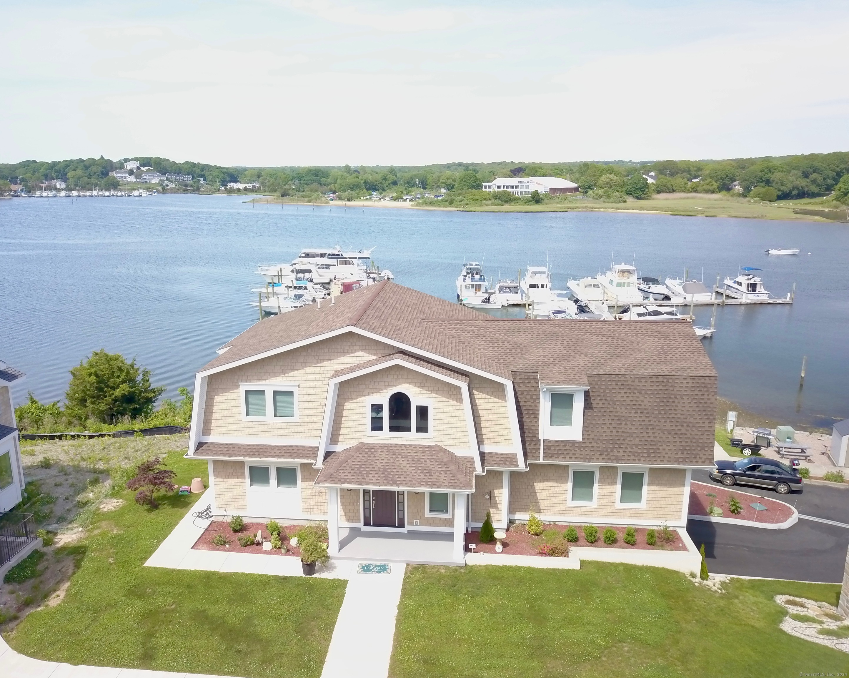 a aerial view of a house with a yard and a floor to ceiling window