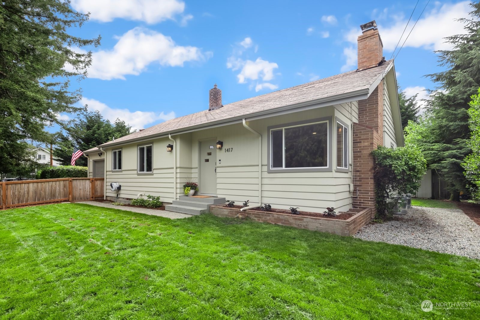 a front view of house with yard and seating area