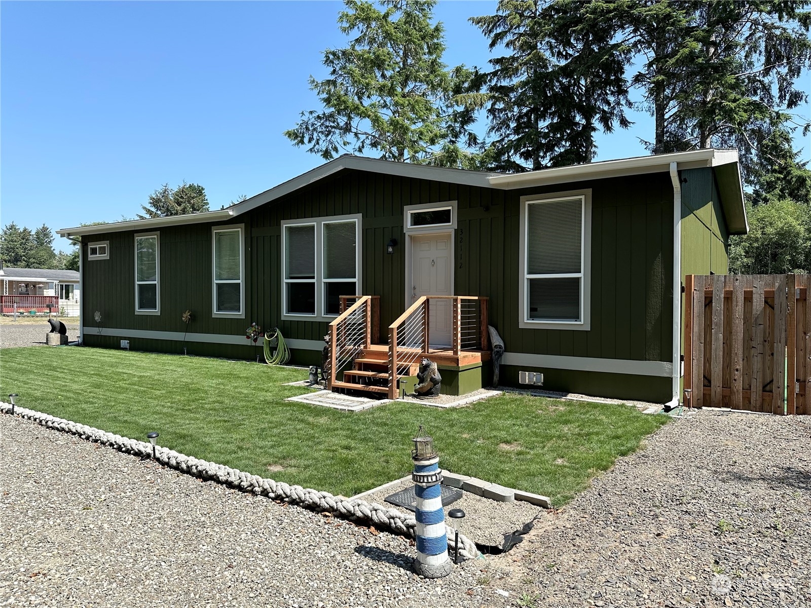 a view of a house with backyard sitting area and garden