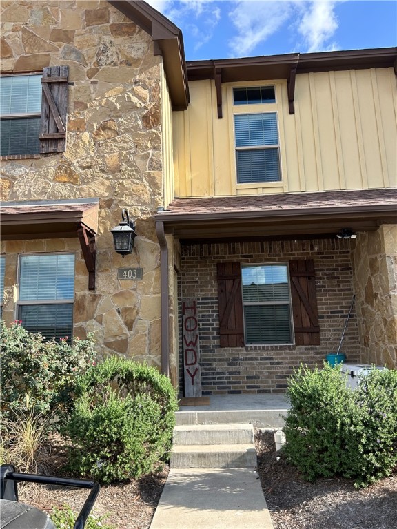 a front view of a house with stairs