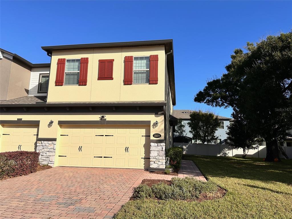 a front view of a house with a yard