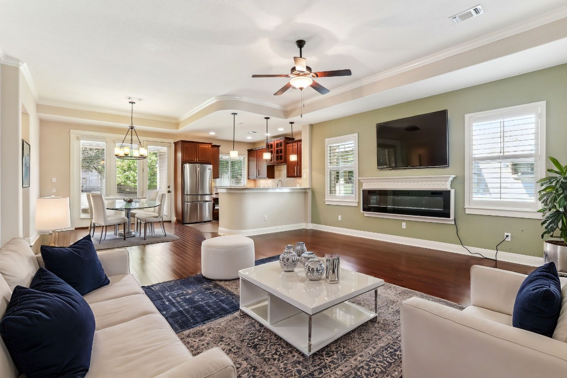 a living room with fireplace furniture and a flat screen tv