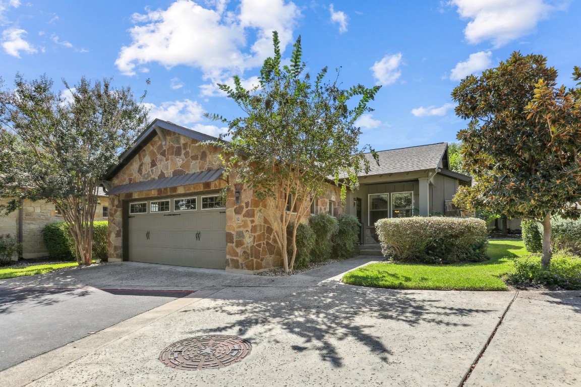 Beautiful front of home with a 2 car garage and landscaped entryway.  House is east facing.