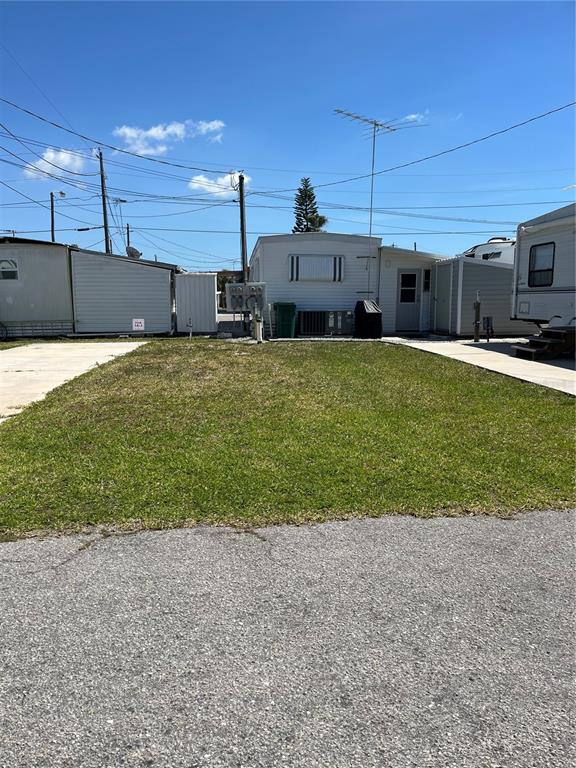 a view of a house with a back yard