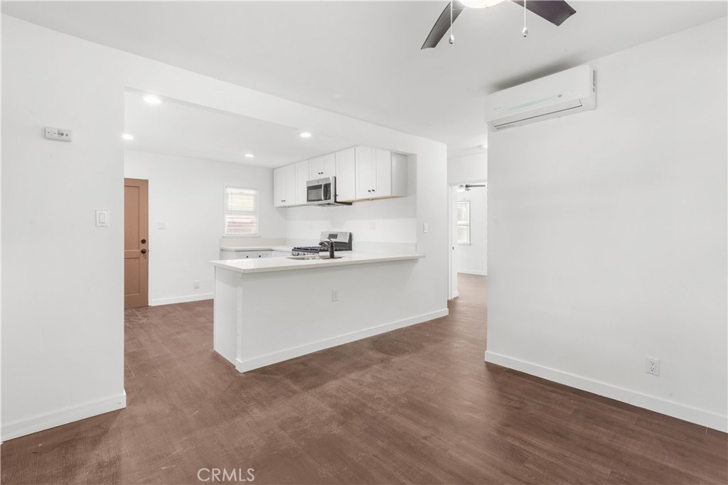 a view of kitchen with wooden floor