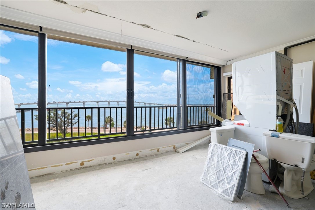 a view of a living room and a balcony