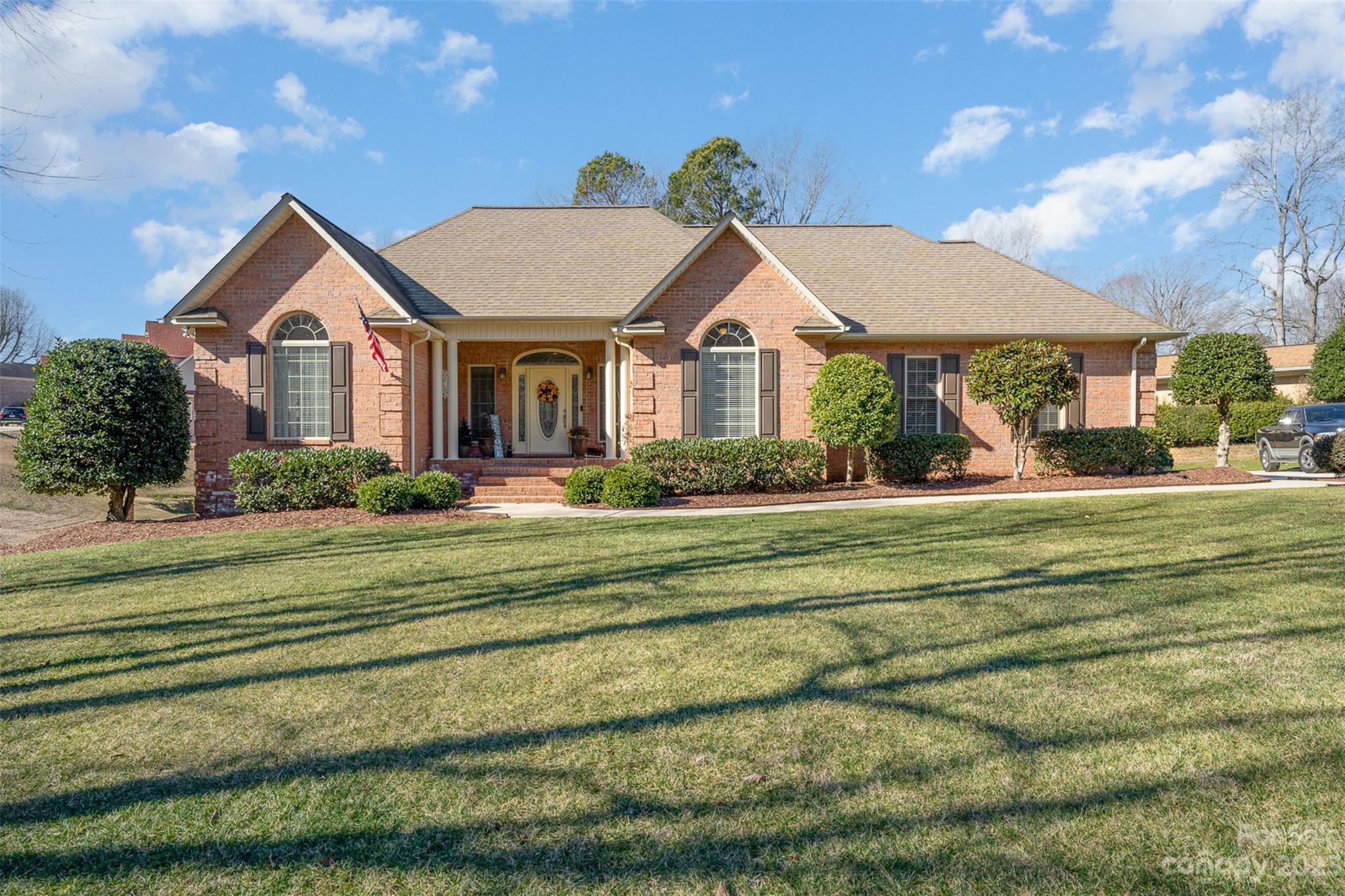 a front view of a house with a yard