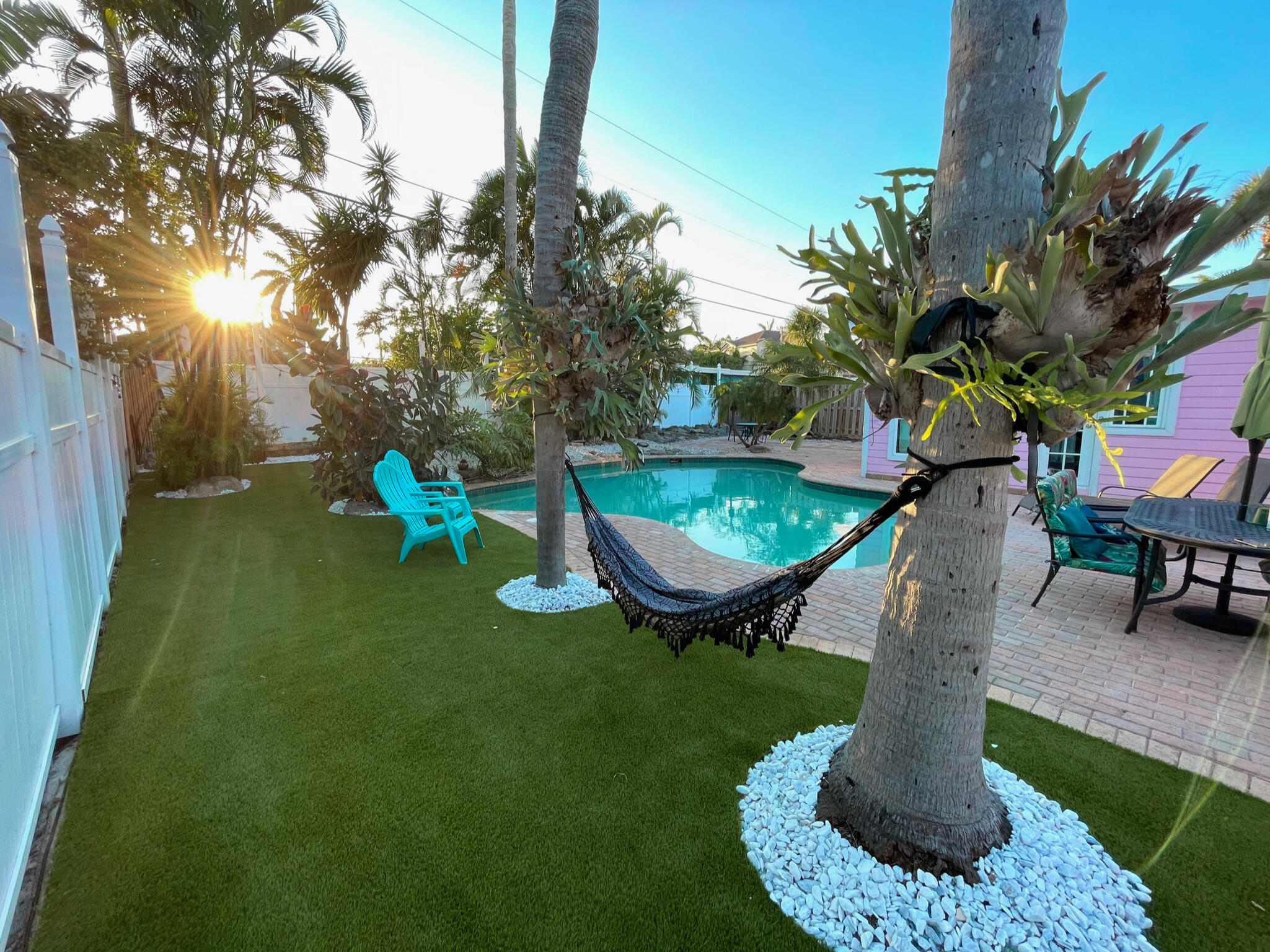 a swimming pool with some trees