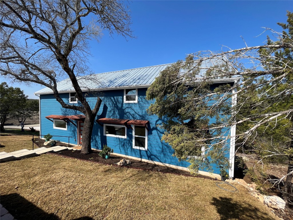 a view of a house with a snow in a backyard