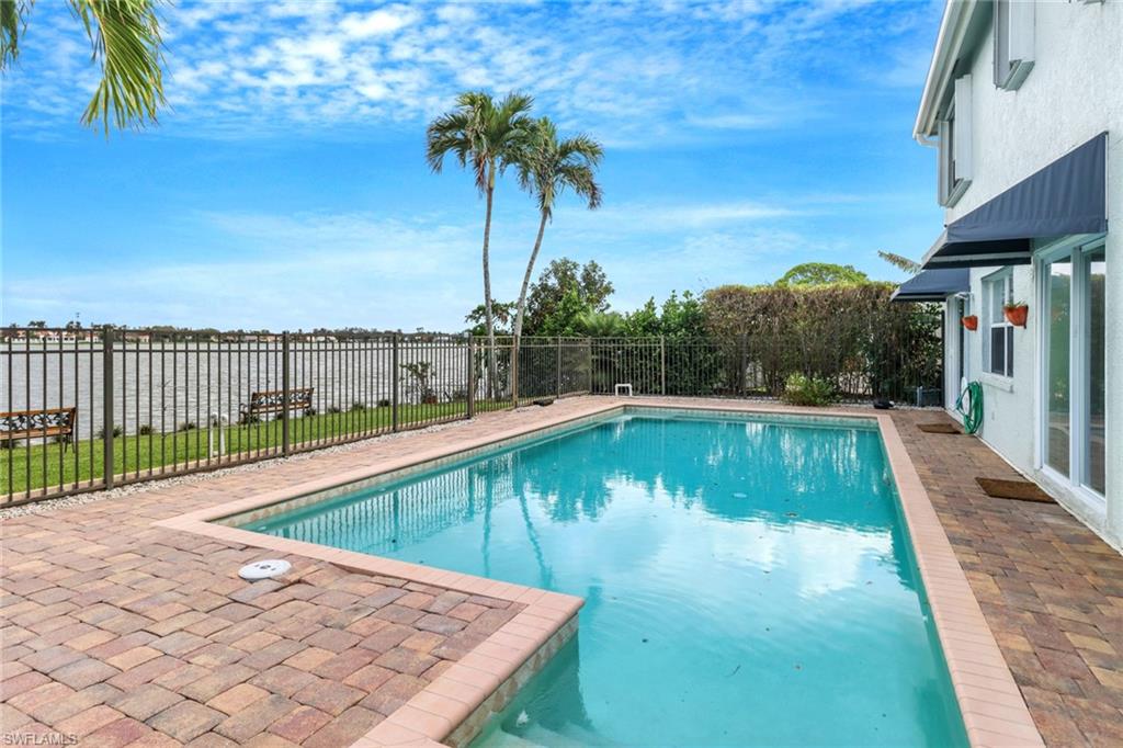 a view of a swimming pool with a patio