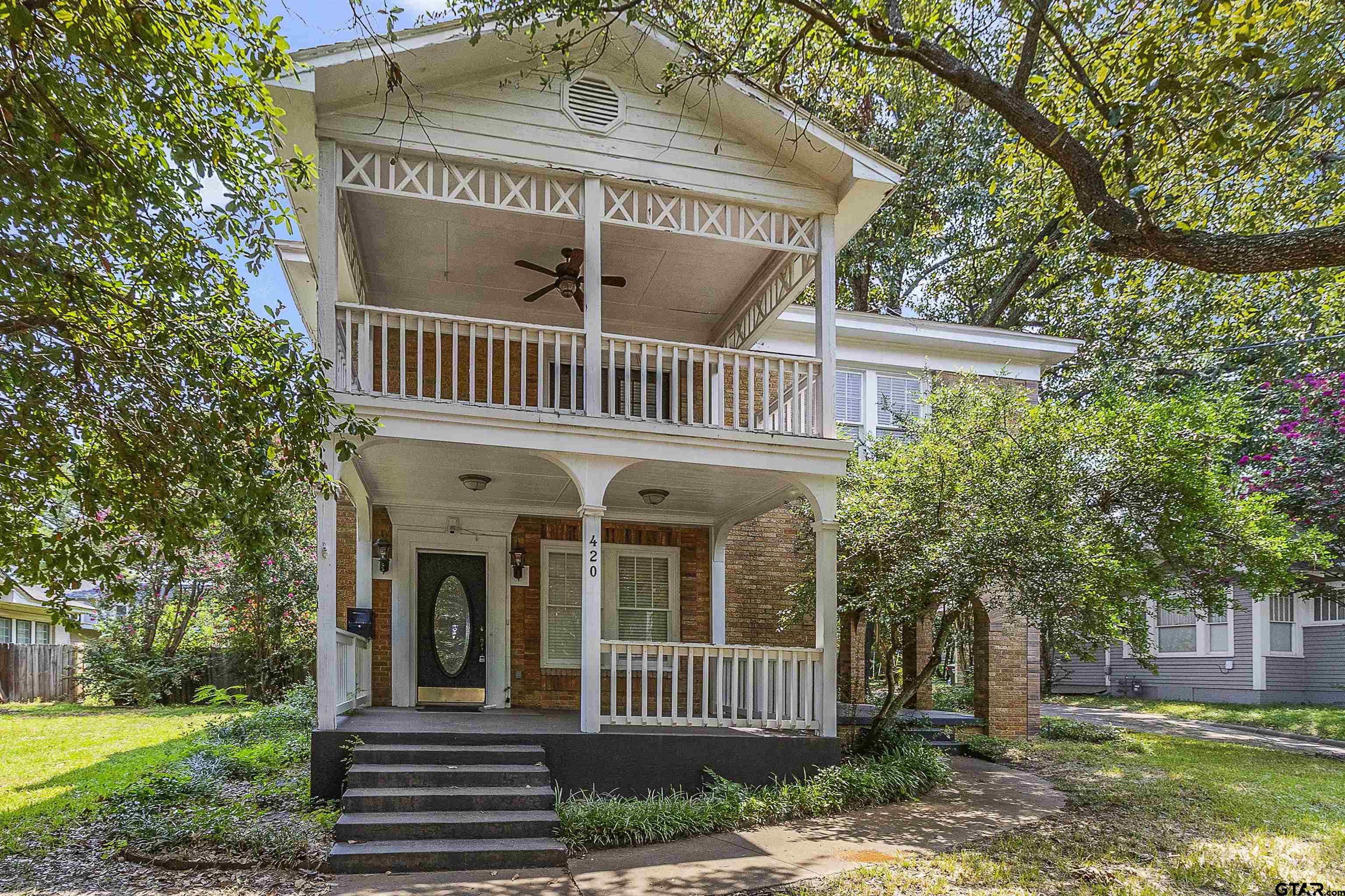 front view of a house with a yard