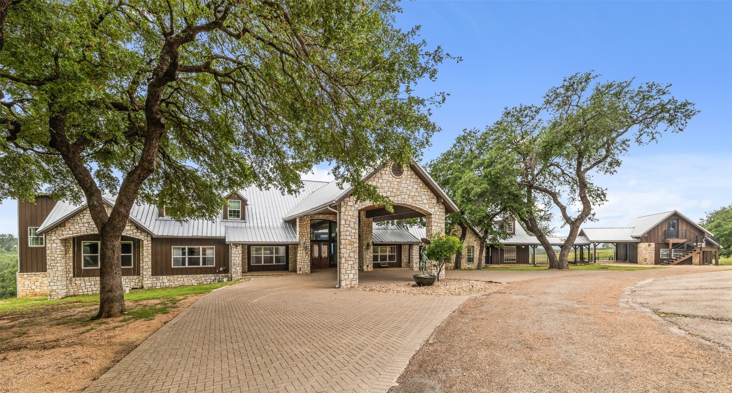 a view of house with outdoor space and trees