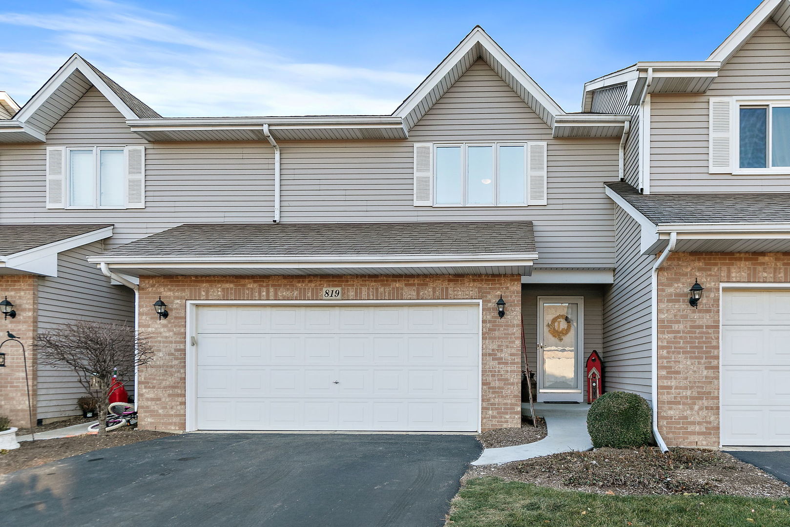 a front view of a house with a garage