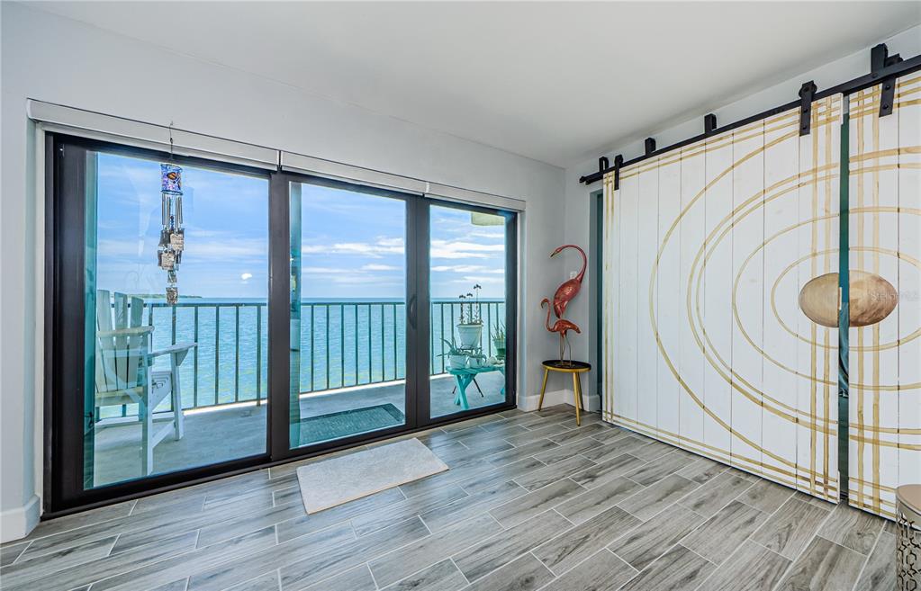 a view of an entryway with wooden floor